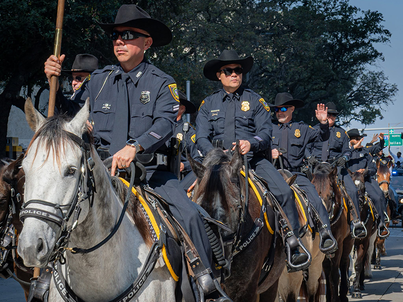Police officers on horses in a procession